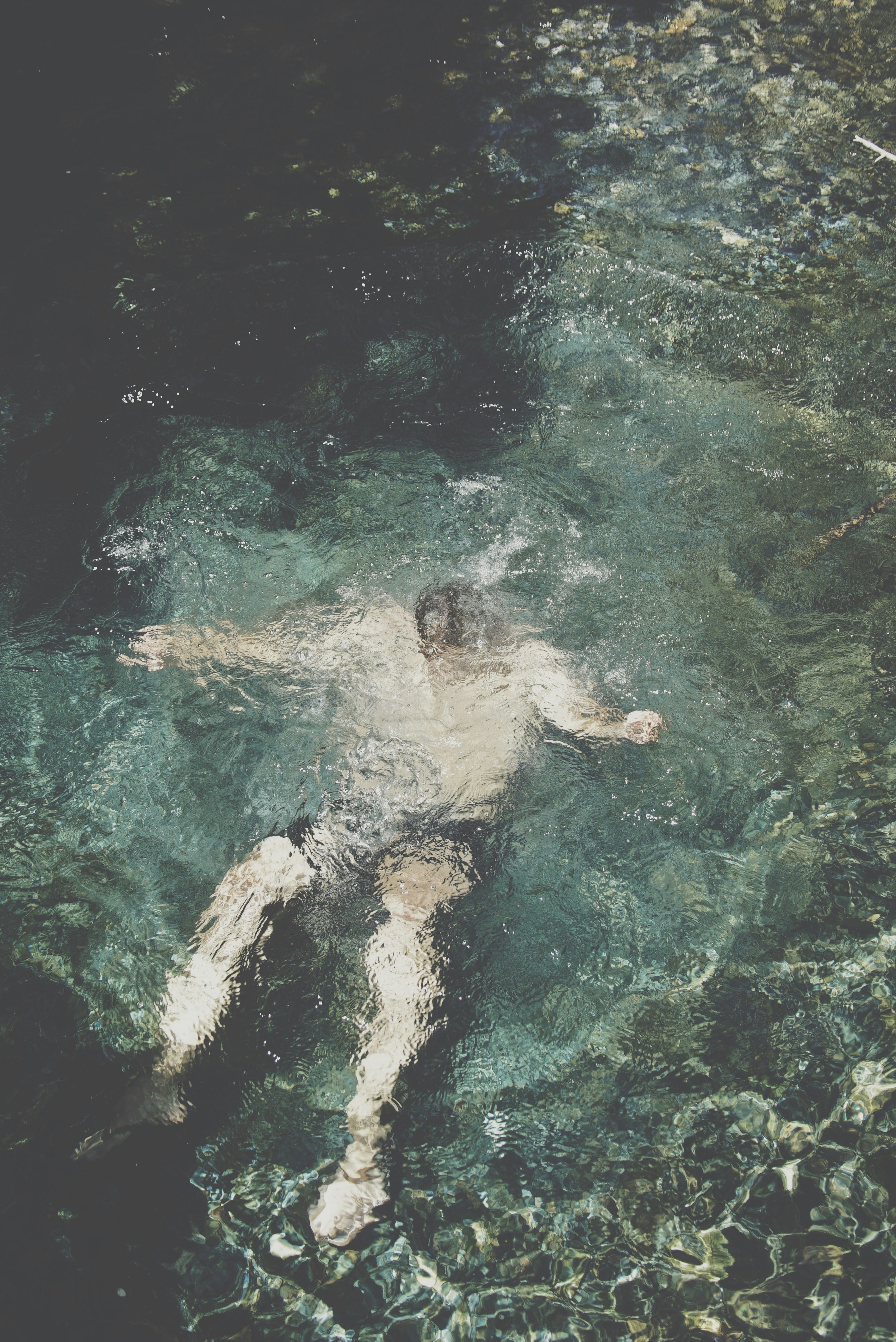 person submerged underwater
